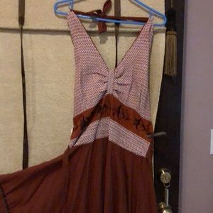 Long rust dress, white contrasting bodice.